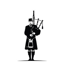 silhouette of bagpiper in kilt