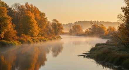 Autumn landscape with river flowing through trees and foliage at sunrise or sunset nature scene