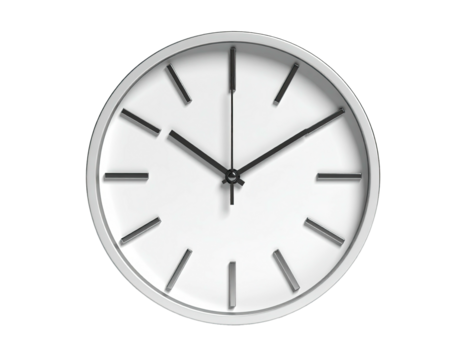 A round white wall clock with black hands against a black background