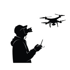 silhouette of a person controlling a drone with a remote