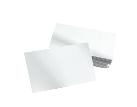 Several blank white rectangular sheets are stacked with one resting in front