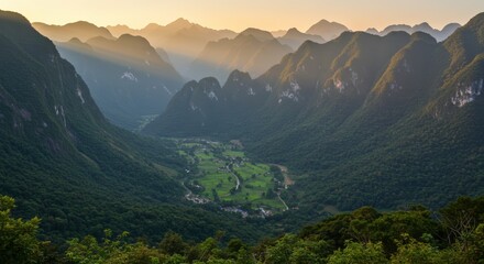 Dramatic aerial view of a vast mountain range with valley featuring natural landscape and sunlight
