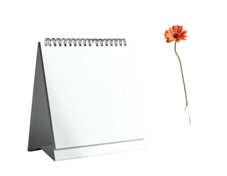 A blank, spiral-bound calendar with a single orange flower on a dark background