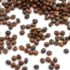 Obraz premium Close up of roasted coffee beans scattered on a white background