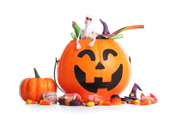 Cauldron with candies for Halloween and pumpkin isolated on white background, closeup