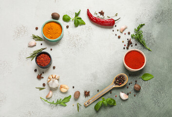 Frame made of herbs and spices on green grunge background