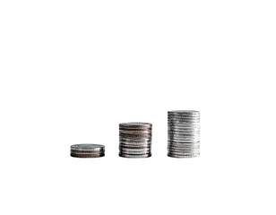 Stacks of currency coins arranged from smallest to largest on black backdrop