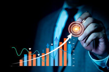 Businessman is touching the growing business graph. Planning and starting corporate business start up