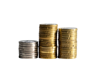 Three stacks of currency coins stand on a black background, showing financial growth