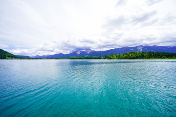 View of Lake Faak and the surrounding landscape in Carinthia. Nature by the lake in Austria.
