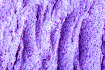 Lilac berry yogurt ice cream with blueberries, blackberries and bilberries. Fresh fruit and berry smoothie. Ice cream texture. Delicious sweet dessert close-up as background.