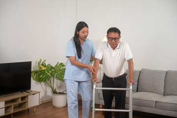 Supportive Stroll: A healthcare worker assists an elderly individual using a walker indoors, portraying care and rehabilitation with a focus on mobility and wellness.