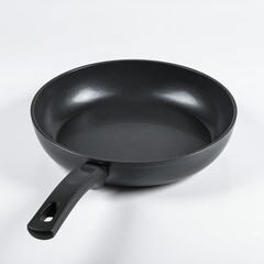 Sleek black frying pan isolated against a pristine white background kitchen utensil