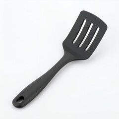 Isolated kitchen utensil: Dark spatula with slits on a clean, plain white backdrop