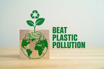 Eco-friendly concept a plant growing from a globe with recycling symbol beat plastic pollution text