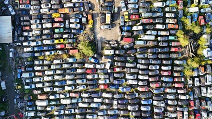 Aerial view of a full car scrapyard with old broken vehicles