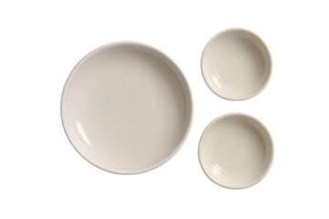Three empty, light beige ceramic bowls,  top-down view