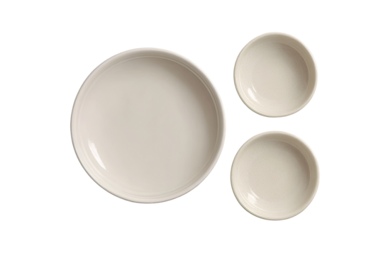 Three empty, light beige ceramic bowls,  top-down view