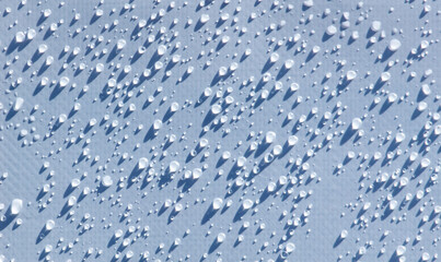 A close up of a wet surface with many small droplets of water