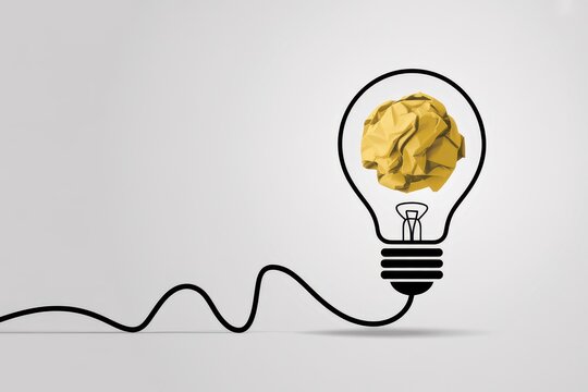 Conceptual illustration of a lightbulb with a crumpled yellow paper ball inside, symbolizing creative block, failed ideas, and the process of innovation - Powered by Adobe