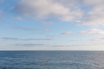 The sky is blue and the ocean is calm