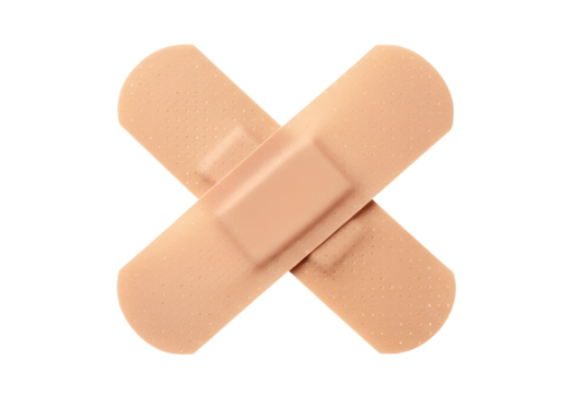 Two light brown adhesive bandages crossing each other in an 'X' shape isolated on a white background