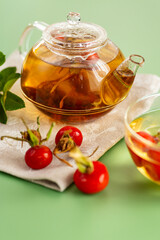 Medicinal rosehip tea with flowers and berries