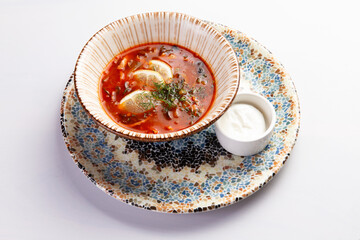 Traditional solyanka soup in a bowl.