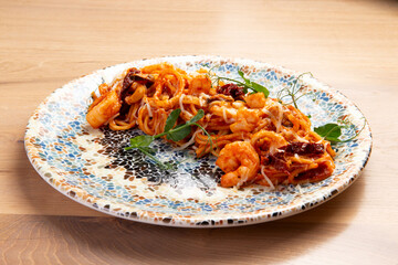 Pasta with shrimp on a plate.
