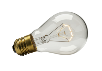 Isolated incandescent lightbulb shows light radiating out from a glowing filament coil