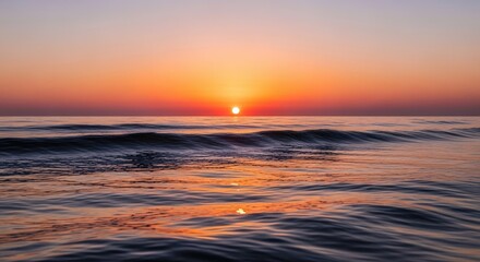 Obraz premium Experience a stunning sunrise over the ocean waves, feel the peace and tranquility wash over you in this captivating coastal scene