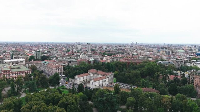 Drone view of Giardini Indro Montanelli Park and Milan, cloudy day