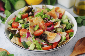 A bowl with Fattoush - Traditional Levantine salad	