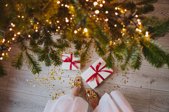 Christmas Gifts Underneath Tree with Lights