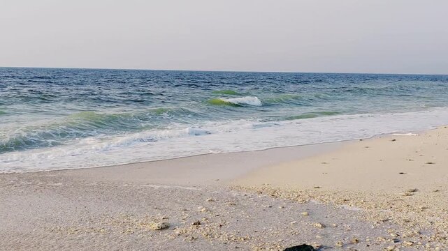 Water waves Sea Shore Beautiful Panorama white sand beach and turquoise water View.
Holiday summer beach background, Wave of sea on White sandy beach.
Enjoy Holiday on Public Beach Heavy Water Waves