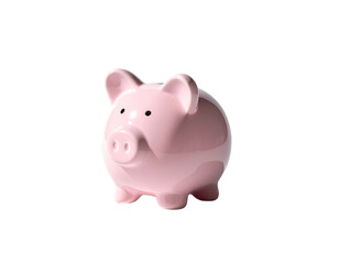 A pink ceramic piggy bank sits isolated on a black background, well lit