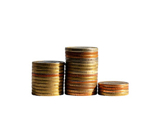 Three stacks of assorted coins against a stark black background