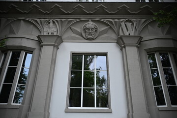 symbols of Wroclaw on the beautifully decorated facade of a school
