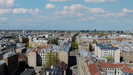 Aerial Drone View Of Riga Panorama In Latvia On A Sunny Spring Day Showcasing The Rooftops Of Houses The Vibrant City Center Historic Buildings And Barona Street Playground of the Downtown Sports Area