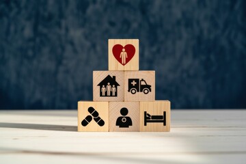 Wooden blocks symbolizing health insurance and medical care with various icons representing services