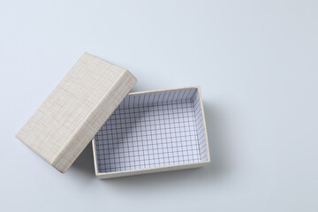 empty paper box with lid on white background, top view