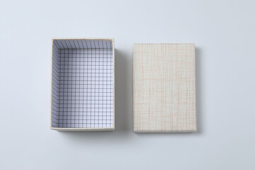 empty paper box with lid on white background, top view