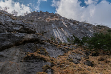 Steep alpine rock walls viewed from below in the Echerntal valley, Austria