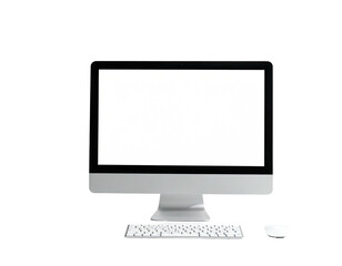 A modern, silver computer with a blank white screen and matching accessories