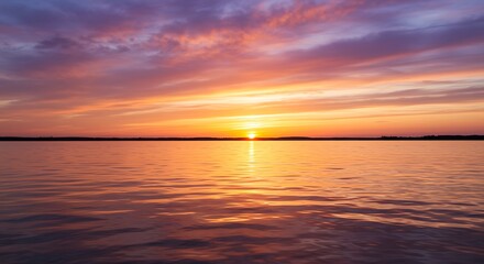 Vibrant sunset over calm water with colorful sky and reflections