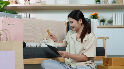 Happy Shopper Enjoying Online Purchases with Cat