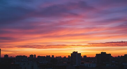 Vibrant sunset over city skyline creating dramatic colorful sky scenery