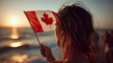 Woman holding Canadian flag by the sea at sunset, perfect for travel blog, web banner