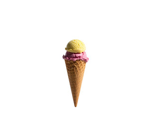 Two scoops of ice cream, yellow and pink, in a waffle cone, against black