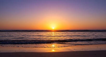 Vibrant sunset over ocean horizon with warm colors and calm water